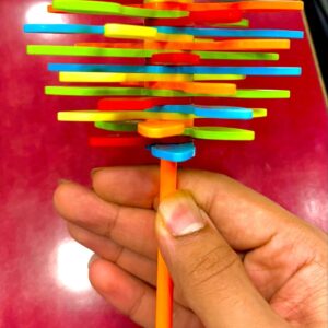 Bright and cheerful candy flower toy with soft petals and a smiling face, perfect for kids