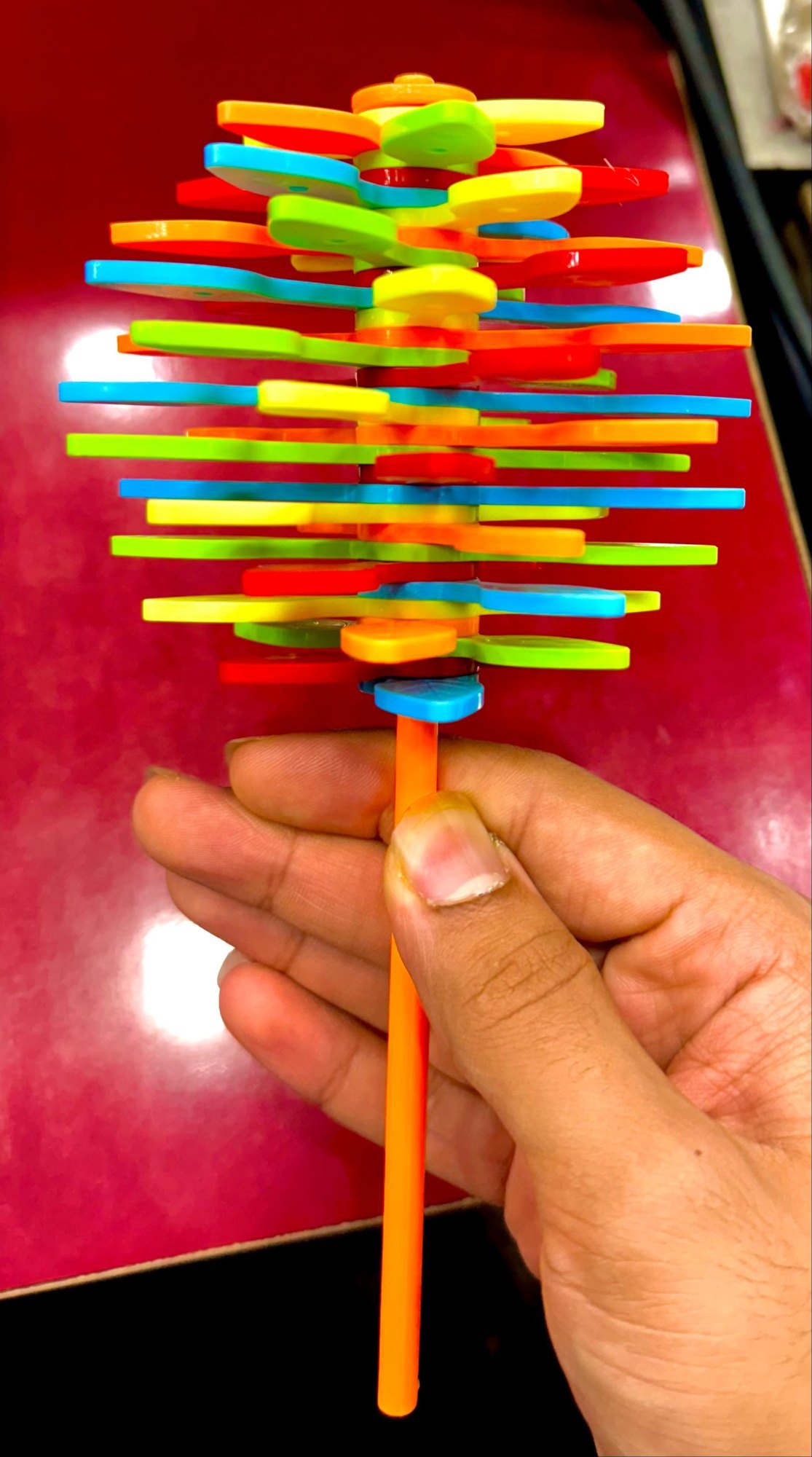 candy-flower-toy Bright and cheerful candy flower toy with soft petals and a smiling face, perfect for kids